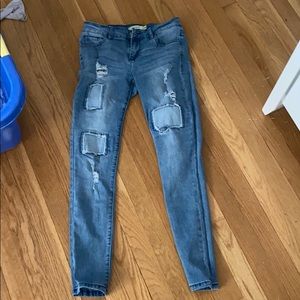 patched/ripped skinny jeans